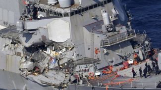 US navy destroyer collides with container ship